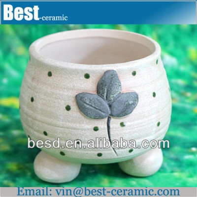 hand painting small white ceramic flower pots